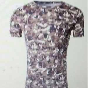 A picture of a man 's shirt with camouflage.