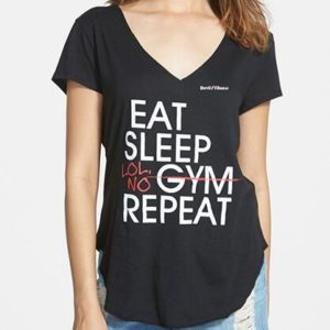 A woman wearing a black t-shirt with the words " eat sleep gym repeat ".