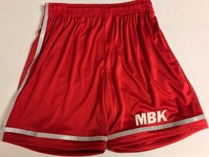 A pair of red shorts with the letters mbk on it.