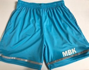 A pair of blue shorts with the initials mbk on it.