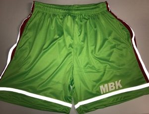 A pair of green shorts with white and red trim.