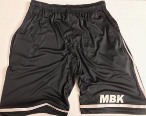 A pair of black shorts with white trim.