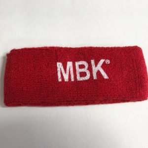 A red headband with mbk written on it.