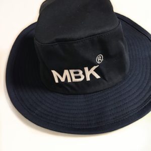 A black hat with the mbk logo on it.