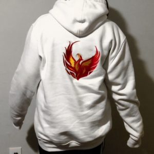 A person wearing a white hoodie with an image of a fire bird.