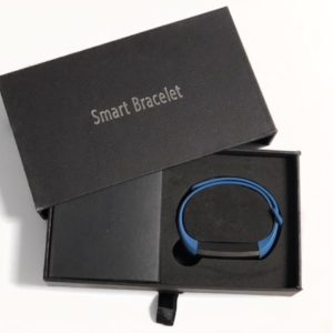 A smart bracelet is in its box.