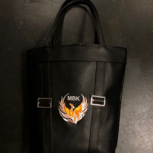 A black bag with an orange and white logo.