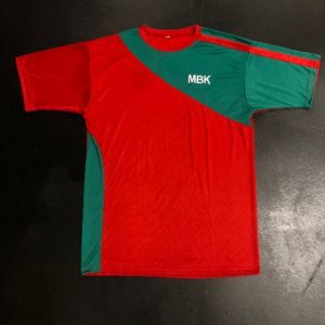 A red and green shirt is on the ground